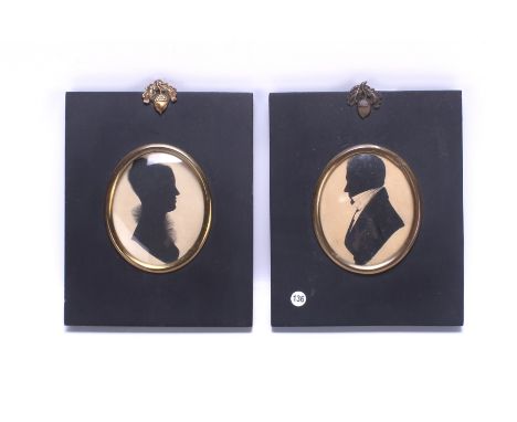A pair of 19th century portrait silhouettes. Glazed in ebonised frames with acorn and oak leaf decoration. 6.5cm x 8cm