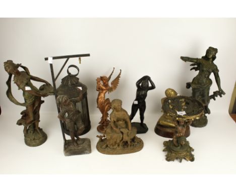 A collection of 19th century pewter and metal figures. Including a lantern, a seated brass piper, etc. Max. H46cm