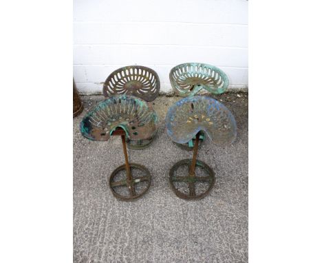 Four rotating garden seats constructed from tractor seats