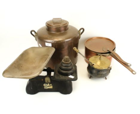 An assortment of metalware. Including a set of scales, a copper saucepan, twin handled pot, etc. Max H31cm