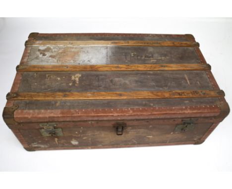 A vintage travelling trunk with metal lining. The exterior bound in steel and wood, H33cm x W93cm x D55cm