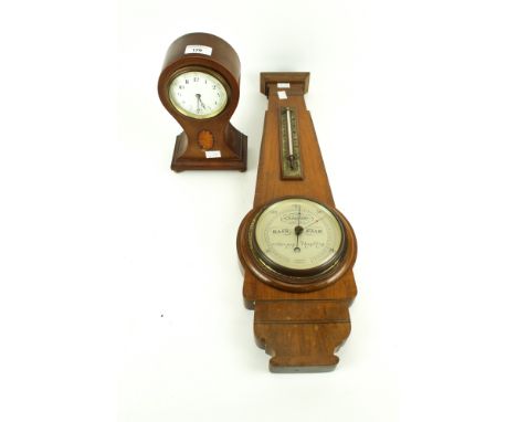 A early 20th century mantel clock and a Taylor, Short and Mason barometer. The clock in a wooden case with inlaid details, H2