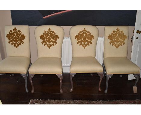 Two pairs of upholstered salon chairs, standing on cabriole legs with scrolling decoration, upholstered in an ivory fabric wi