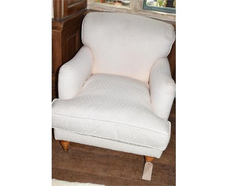 A contemporary open easy chair, upholstered in ivory coloured fabric, Height 84cm x Width 77cm x Depth 100cm 