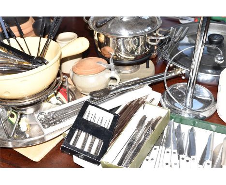 Various kitchen items, including fondue set, steak knives. 2 cocktail shakers, chop sticks, lemon squeezer etc.