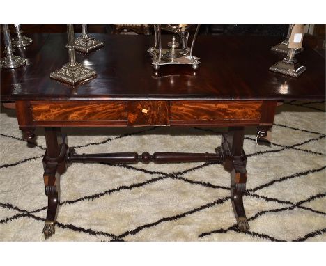 A Regency mahogany sofa table, standing on lyre supports with cast brass paw mounts, Height 74cm x Width 100cm x Depth 77cm 