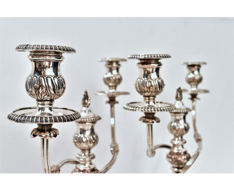A fine pair of Regency period old Sheffield plate candelabras circa 1810 standing on circular foot, with beaded rim, tapering