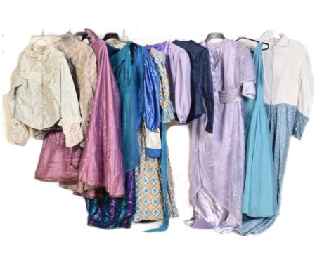 A collection of vintage 20th century theatrical costume womenswear dresses, all decorative and many custom made in shades of 