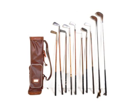 A collection of vintage mid 20th century golf clubs, used as props in theatrical productions and stage performances. The lot 