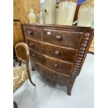 19th cent. Mahogany bow front chest of drawers on bracket feet with shaped front apron, turned