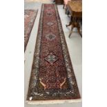 Rugs & Carpets: 20th cent. Runner, Asian style predominantly in red hues with striking blues and