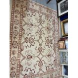 Rugs & Carpets: Modern weave rug, ivory colour highlighted with reds, blues and green. 94ins. x