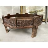 20th cent. Traditional Indian Chakki low table, the sides and supports carved profusely with