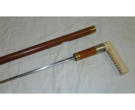 Late 19thC sword cane with white metal collar inscribed G.H. James Lincoln with carved ivory handle with 14 inch blade