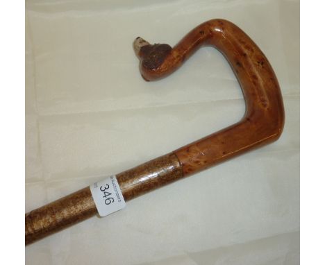 Shepherd's walking crook stick with carved wood handle with the head of a dog