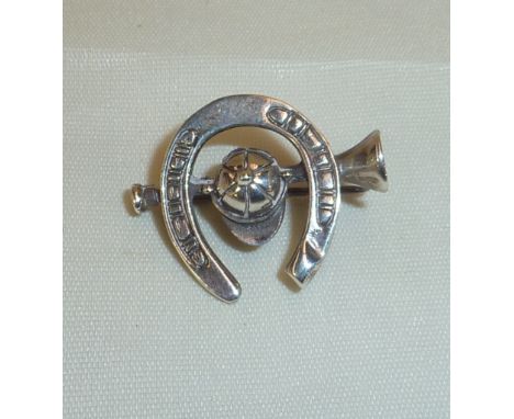 Sterling silver brooch in the form of a hunting horn, horseshoe and cap