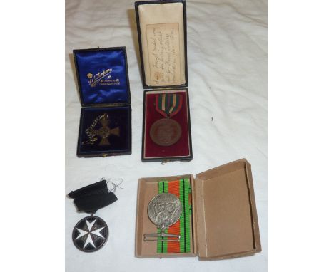 WWII defence medal in original postage package awarded to J.T. Dalby, cased St John's Ambulance cross, cased school competiti