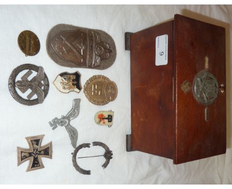 Wooden box with hinged top in set with German combat badge, enamel badges etc with contents comprising of Demjansk 1942 badge