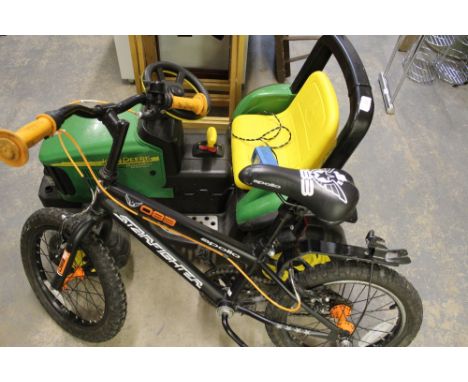 John Deere electric tractor and childs bike