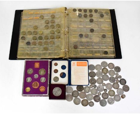 A collection of UK coins comprising a quantity of silver half-crowns and threepence, an incomplete folder containing half-sil