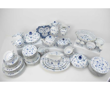 ROYAL COPENHAGEN; a seventy-five piece dinner set decorated in the 'Onion' pattern, including gravy jug, length 13cm, egg cup