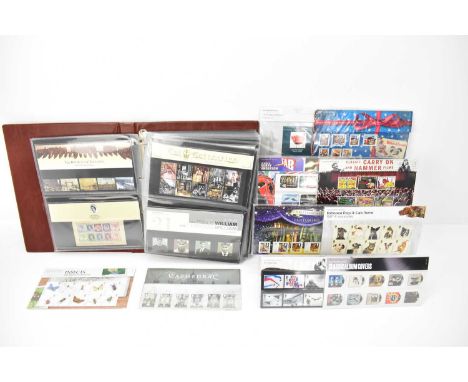 A large Royal Mail presentation album containing seventy-six stamp sets including Carry On films, Wallace &amp; Gromit, Thund