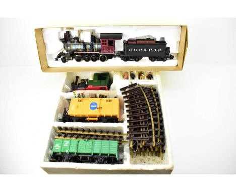 A boxed Lehmann Cross-Bahn 20401 train set comprising engine, two carriages, track and four figures, and a boxed Polk's Model