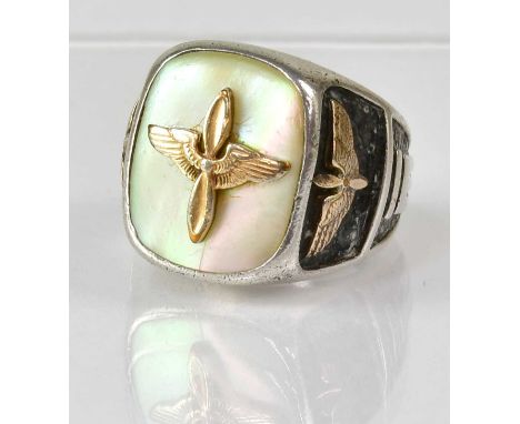 A WWII sterling silver mother of pearl inlaid US Air Force ring, the main mother of pearl table with applied wings and propel