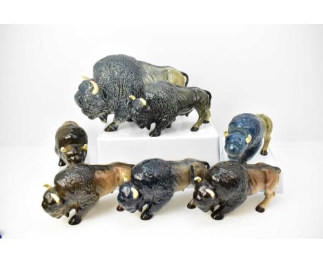 Seven mostly Melba Ware ornamental bison/buffalo figures, height of largest 20cm, length 36cm, the others 14cm x 25cm, mostly