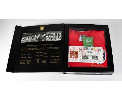 BOBBY MOORE; a boxed 1966 50th Anniversary signed shirt, together with a first day cover signed by Geoff Hurst, Martin Peters