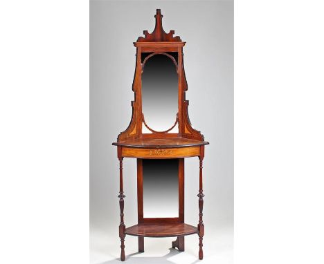 Edwardian rosewood corner cabinet, the arched top above a mirror back and inlaid shelf with a frieze drawer to the turned sup