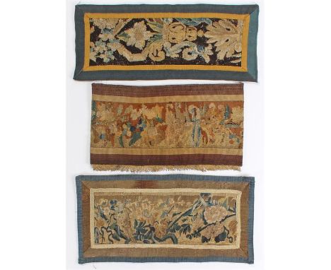 Three early 18th Century textiles, wool fragments presented on later borders, with floral decoration, the largest 64cm x 27cm