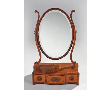 George III mahogany and satinwood toilet mirror, the oval mirror plate held by arched supports above a fan inlaid serpentine 
