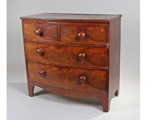 George III mahogany bow front chest of drawers of small proportions, the shaped top above a two over three drawer configurati