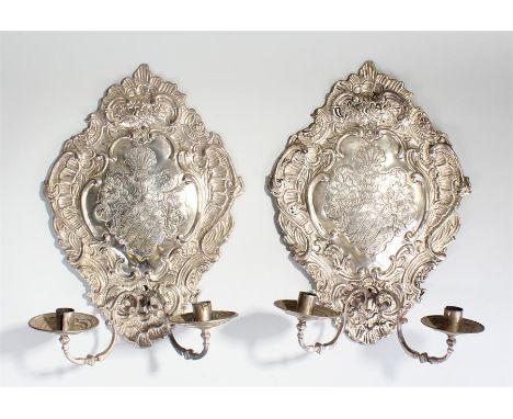 Pair of 19th Century silvered wall sconces, decorated with a crest to the centre surrounded with C scrolls, shells and flower