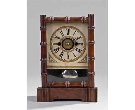 Early 20th Century German alarm clock, the stained case with bamboo border with a white dial and Roman hours, 25cm high
