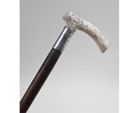 Meiji period Japanese monkey carved walking stick, the handle carved with monkeys in various poses, above a silver collar and