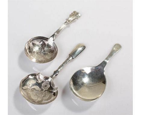 Three caddy spoons, to include a plain example Edinburgh 1910, maker Hamilton & Inches, the second with flower decoration Bir