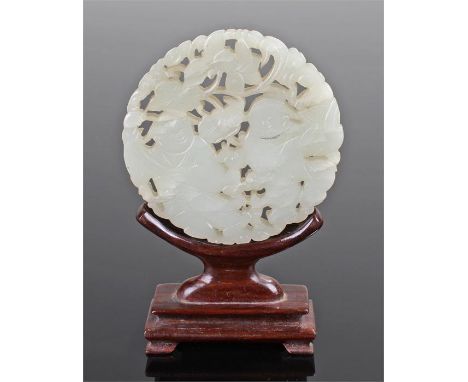 18th Century white jade plaque, Qianlong period, the disc carved with open work and God of Harmony, 80mm diameter, together w