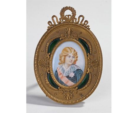 After Jean-Baptiste Paulin Guerin, a portrait miniature of a young man with star, pink sash, signed far left, housed within a