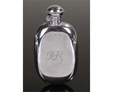 George V silver hip flask, Birmingham 1911, makers mark rubbed, the twist top hinged above an oval flask with monogram, 3.7oz