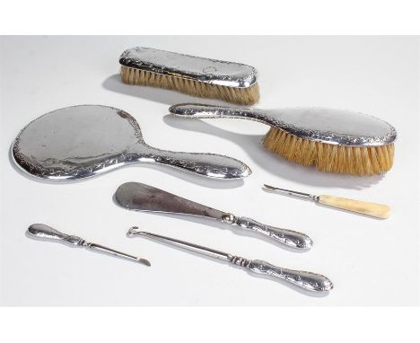 Silver vanity set, Birmingham 1932, maker W.A. with ribbon decoration, consisting of a mirror, two brushes, button hook etc, 