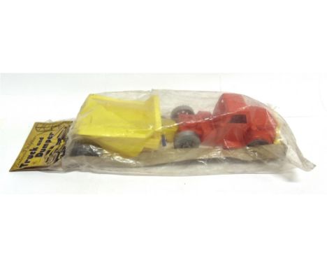 A TUDOR ROSE PLASTIC TRUCK AND DUMPER  circa 1950s, with a red tractor unit and yellow trailer, in original plastic bag with 