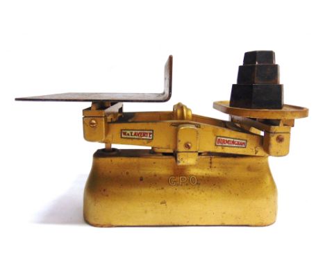 A SET OF G.P.O. SCALES BY W. &amp; T. AVERY, BIRMINGHAM  with a gold finish, 37cm long; together with three stacking weights.
