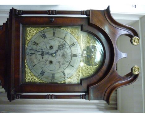 A William IV mahogany longcase clock, the hood having a swan neck pediment over a recessed panelled door with carved quadrant