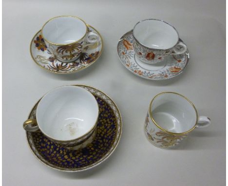 An early 19thC New Hall porcelain tea cup and saucer with a ring handle and a matching coffee can, decorated in gilded iron r