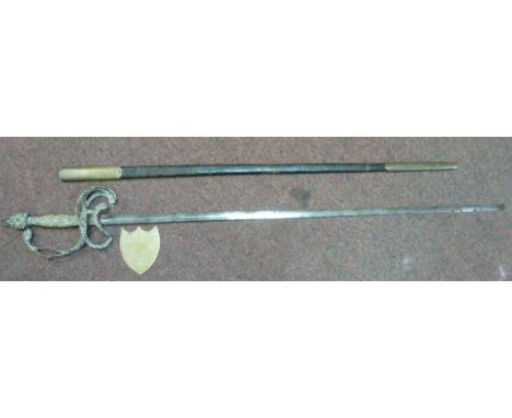 A late 19thC British presentation sword with a decoratively cast brass handle and hilt, the blade 32''L in a brass mounted hi