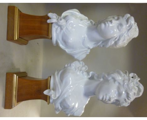 A pair of Royal Worcester ivory glazed china busts, on partially gilded mahogany plinths, circa 1970 'Night' and 'Day' person