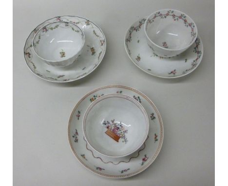 Three similar late 18thC New Hall porcelain tea bowls and saucers, decorated in colours with simple floral designs  pattern n
