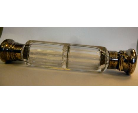 A late Victorian silver mounted, double ended, faceted, cylindrical clear glass scent bottle, one end having an outset hinged